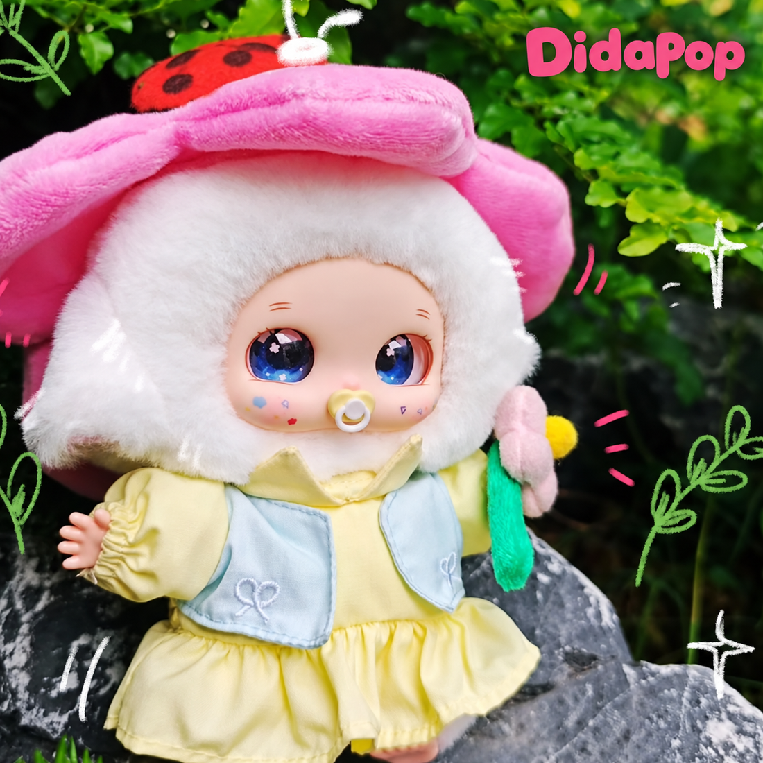 NORA Spring Outing Team plush in a pink hat and yellow outfit, photographed outdoors