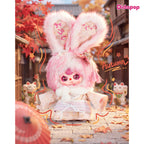 Baby Three Japan 400% pink bunny plush in a kimono with white scarf and pink tassel in an autumn scene