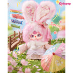 Pink Baby Three Japan 400% plush with a floral kimono and tassel hair accessory in a spring scene